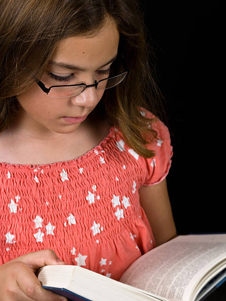 istock Caucasian Little girl Reading a Book 114242788