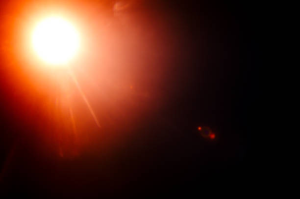 istock Abstract Natural Sun flare or Far star on the black background 1142428384