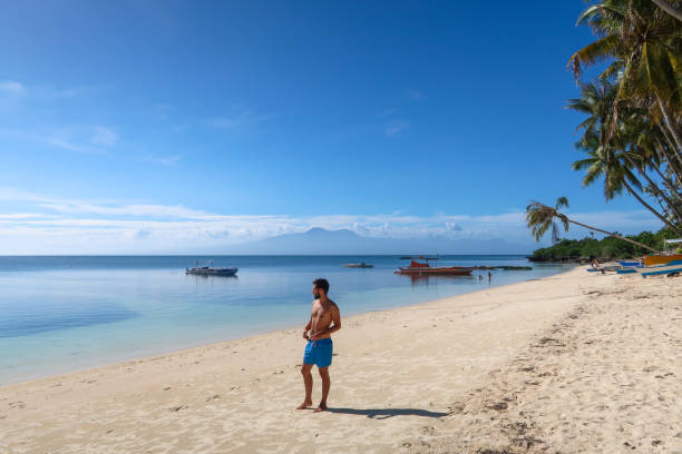 istock Man walking in the beach 1142428444