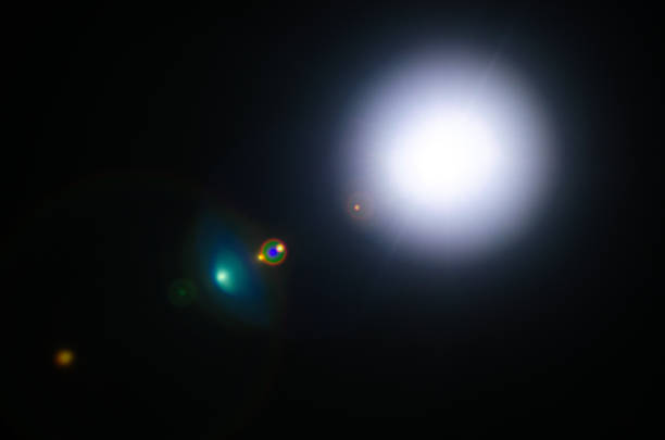istock Abstract Natural Sun flare or Far star on the black background 1142429690