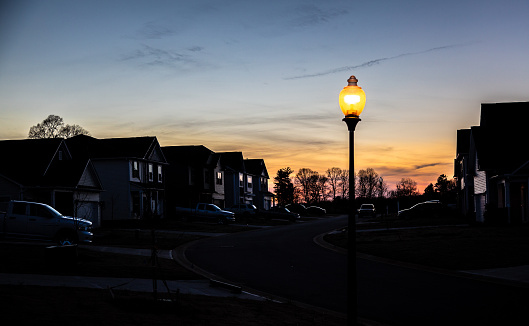 Sunset behind quiet suburban neighborhood