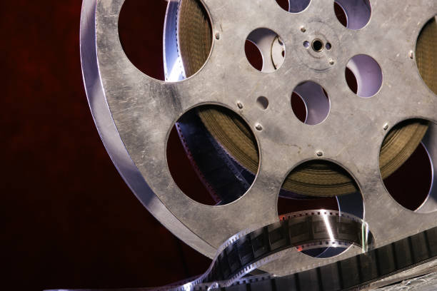 istock 35 mm film reel with dramatic lighting on a dark background 1142432903