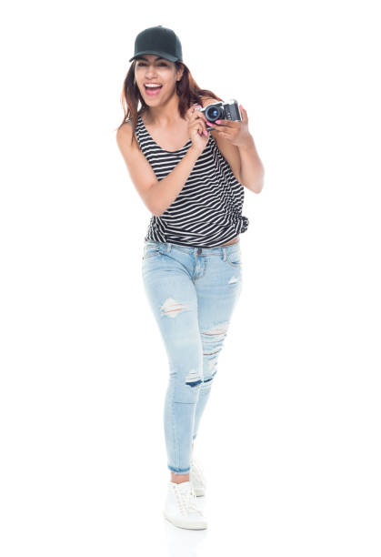 istock Female photographer holding a camera 1142432935