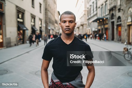 istock Portrait of a young adult man in the city 1142434706