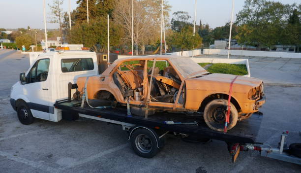 transport of an old, broken, rusty car for the purpose of restoration and repair. - obsolete imagens e fotografias de stock