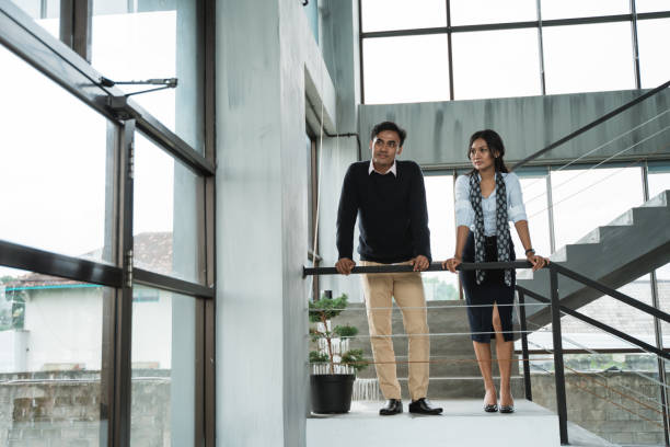 istock business people chatting in balcony 1142435533