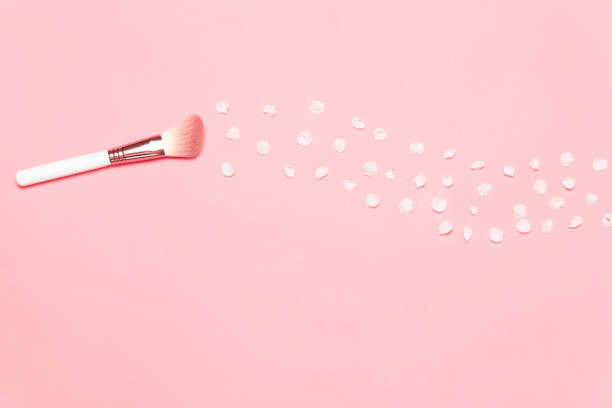 istock Composition with flowers and cosmetics on pink background. 1142435594