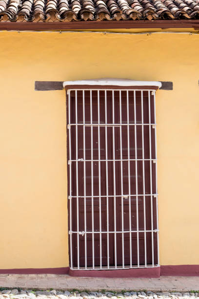 Door on streets of Trinidad, Cuba Historic city of Trinidad, Cuba. Trinidad is a town in central Cuba, known for its colonial old town and cobblestone streets. Photo taken on 3rd of November, 2019. entrence stock pictures, royalty-free photos & images