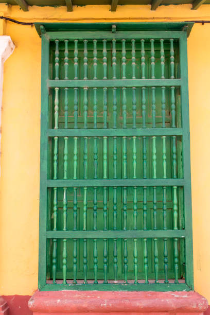 Door on streets of Trinidad, Cuba Historic city of Trinidad, Cuba. Trinidad is a town in central Cuba, known for its colonial old town and cobblestone streets. Photo taken on 3rd of November, 2019. entrence stock pictures, royalty-free photos & images