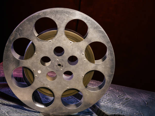 istock 35 mm film reel with dramatic lighting on a dark background 1142436552