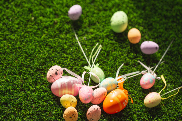 istock Bunch of colorful Easter eggs on green grass 1142440384