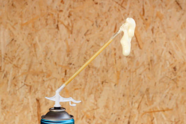 Spray can with foam which is used in construction. Spray can with construction foam that is used daily construction spray insulation stock pictures, royalty-free photos & images
