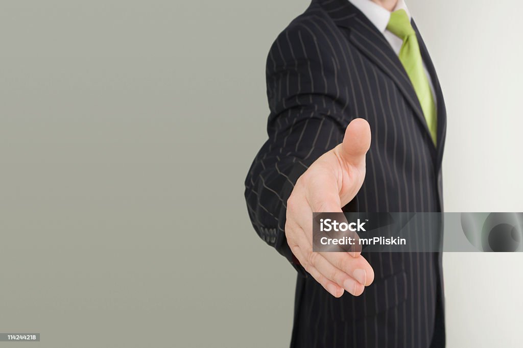 Uomo d'affari di handshake - Foto stock royalty-free di Abbigliamento formale