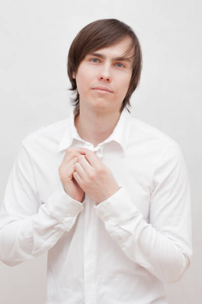 istock young man in a white shirt. 1142443428