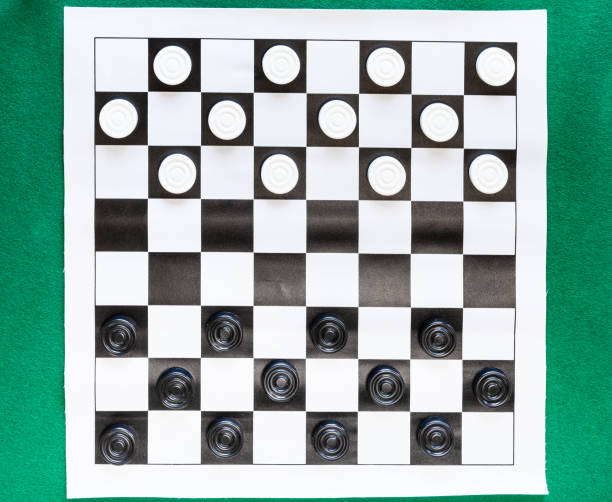 istock top view of draughts on black and white sheet 1142445923