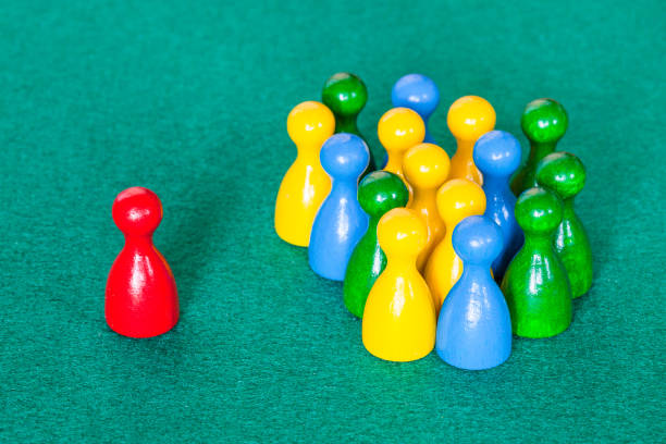 istock one red pawn in front of many various pawns 1142445961