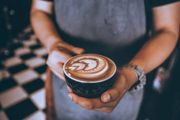 istock Professional Barista Making coffee latte art in cafe. 1142450864