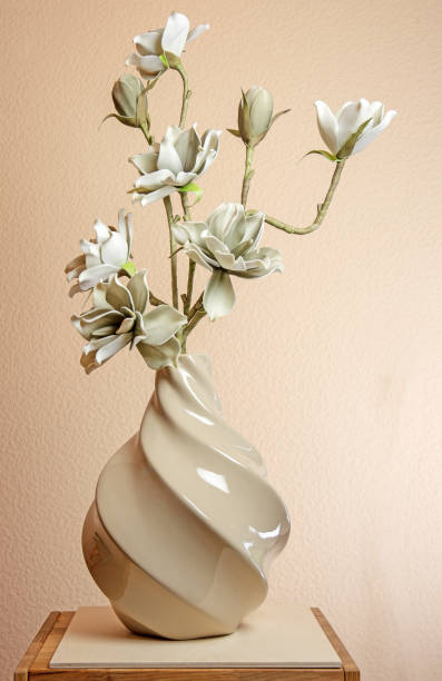 istock Artificial magnolia blossoms in a vase 1142461451
