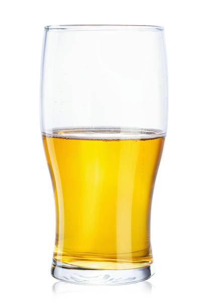 istock Half a glass of beer on a white background isolated. 1142461522