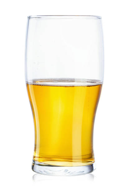 Half a glass of beer on a white background isolated. stock photo
