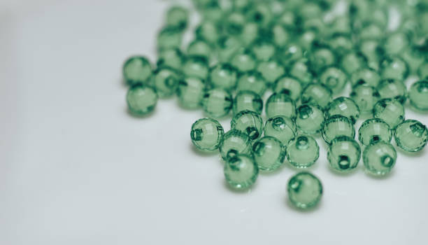 istock Green glass beads on a white background. Macro view. 1142464285