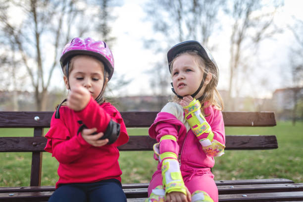 istock Tired children after a day on rollerblades at a park 1142469817