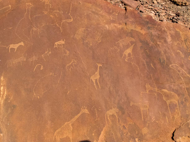 istock TOURISTS VISITING CAVE PAINTINGS IN AFRICA 1142470355