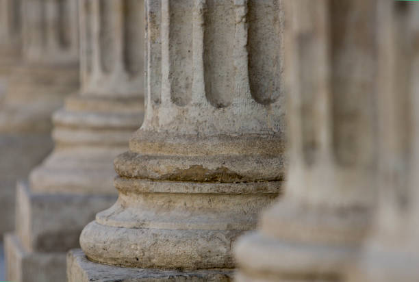 istock Ionic order column base detail of a neo-renaissance building in a selective focus image. 1142471892