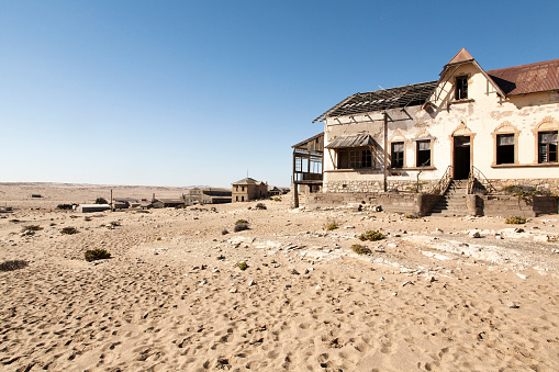 City buried in the Namibian desert. Lüderitz\nGhost town, picturesque, desert, empty.