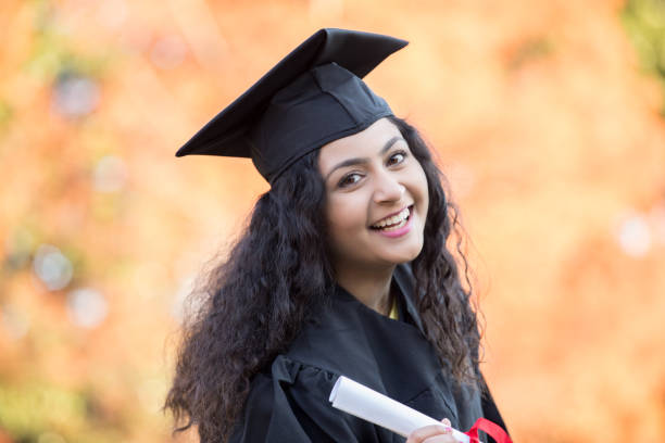 istock Happy female Indian graduates 1142473764