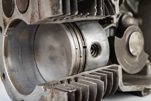 istock A four-stroke gasoline engine in section. The interior of a single-cylinder internal combustion engine. Dark background. 1142474179