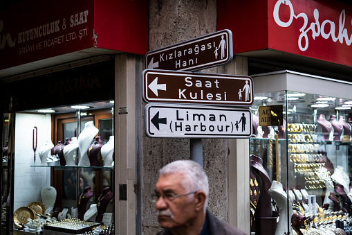 Izmir, Turkey - April, 2019: People walking in Kemeraltı Market... Kemeraltı Bazaar’s history goes back till the Byzantine Empire. The bazaar, which hosts thousands of people every day. Kemeraltı is the city’s heart with the inns  and it is a labyrinthine bazaar stretching from Konak Square through to the ancient Agora.