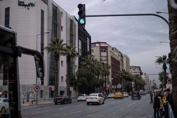Traffic in Cankaya avenue. People waiting for to cross the street. One of the main avenue at the heart of the city.