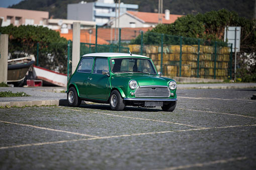 Classic car of green color in exhibition in celebratory fair.