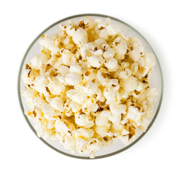 istock Popcorn in a glass plate top view. 1142477924