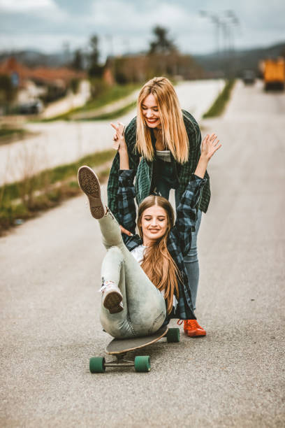 istock Women Learning to use a Skateboard 1142478761
