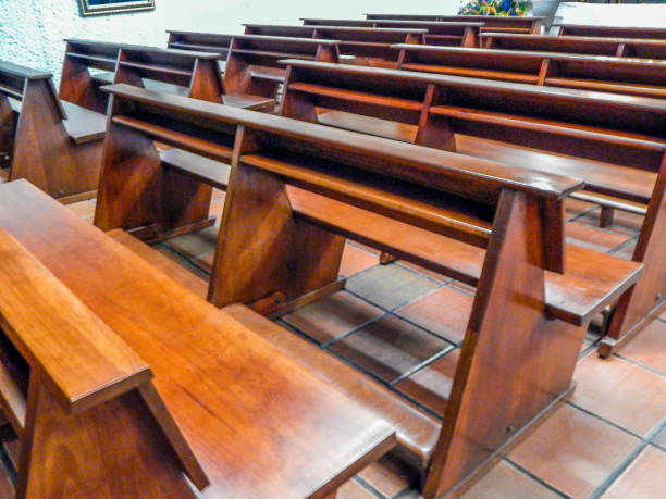 istock Church benches with brown tiled floor and white walls 1142480053
