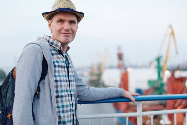 istock Happy man on the deck of cruise ship 1142481287