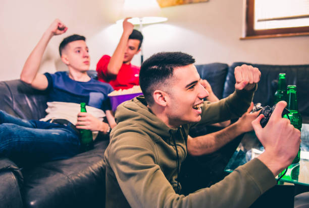 istock Excited guys play video game 1142484272