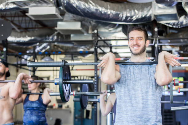 istock Group of strong men and women doing workouts together 1142485549