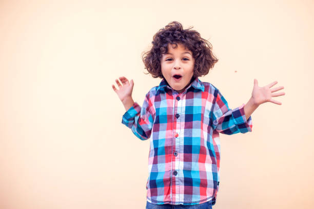 istock Adorable young boy surprised. Shock, amazement, surprise concept. 1142487161
