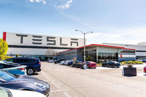 Exterior view of Tesla Factory located in Fremont, California April 12, 2019 Fremont / CA / USA - Exterior view of Tesla Factory located in East San Francisco bay area, California; Tesla logo displayed on the exterior wall supercharged engine stock pictures, royalty-free photos & images