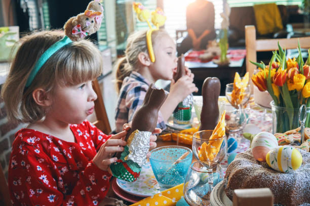 istock Little Kids Eating Chocolate Easter Bunny 1142490010
