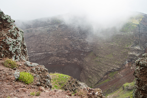 Morning fog, smoke and ash in the air. at the crater of Mount Vesuvius, Naples, Italy.