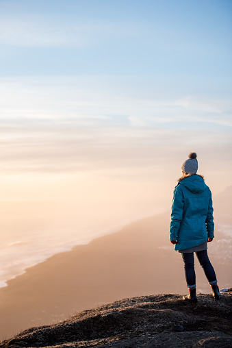 A young solo female traveler enjoying the sights of Iceland.