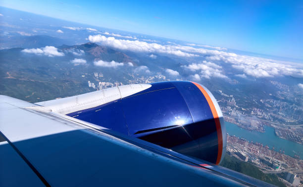 istock Blue sky and white clouds from window of aircraft flight in summer 1142492910