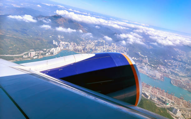 istock Blue sky and white clouds from window of aircraft flight in summer 1142492913