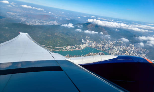 istock Blue sky and white clouds from window of aircraft flight in summer 1142492914