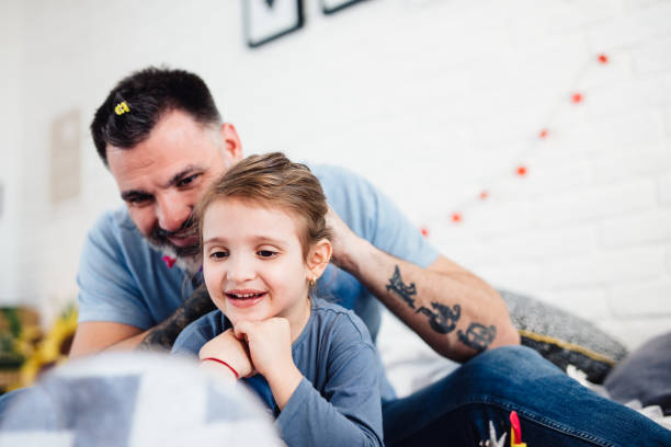 istock Family Time! Single dad brushes daughter's hair 1142493862
