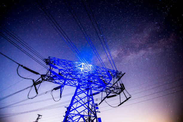 istock Electric tower at night, the Milky Way 1142494749